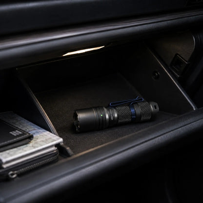 Cree Lighting X14 compact EDC flashlight stored in car glove compartment for emergencies