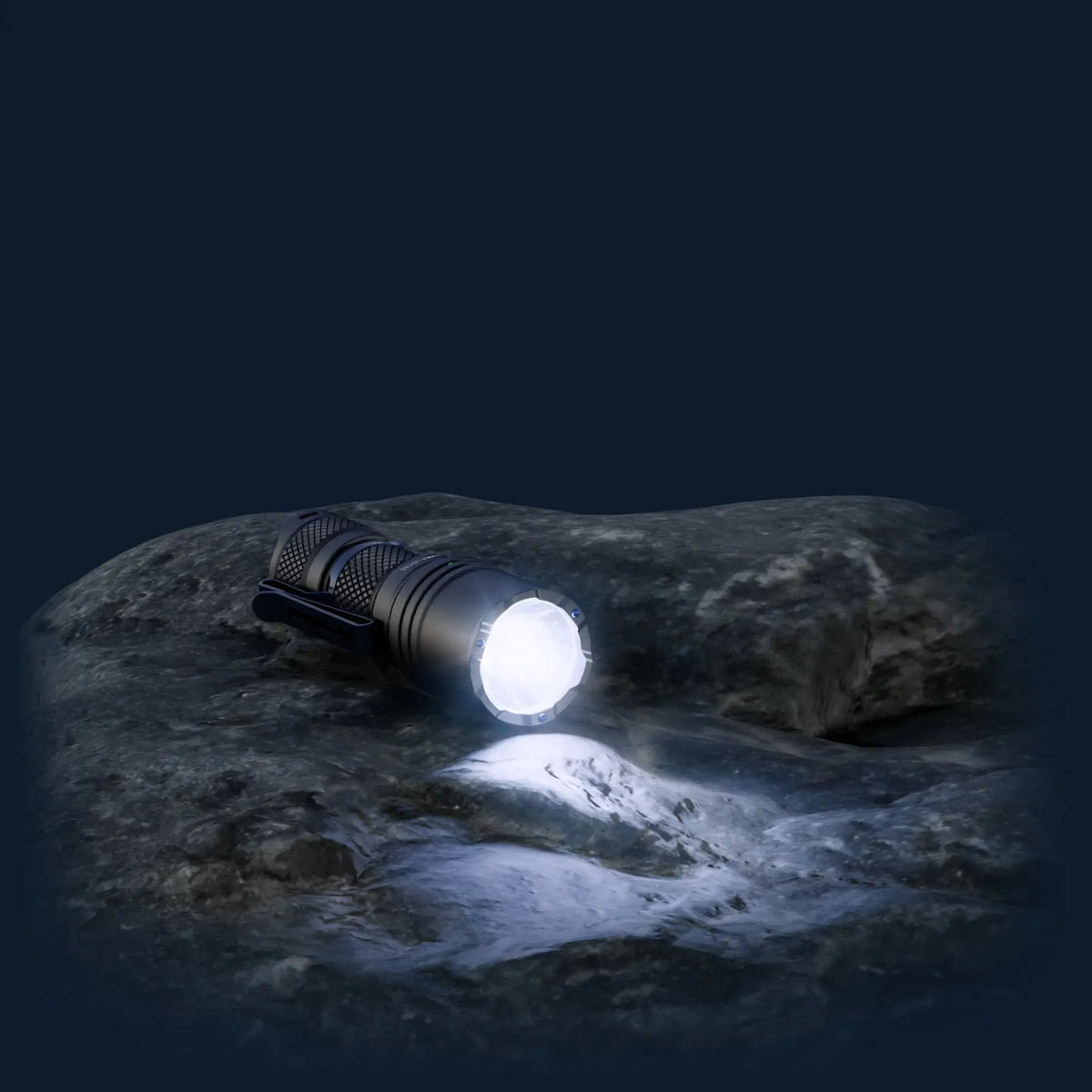 Cree Lighting X14 IP68 waterproof tactical LED flashlight illuminated on wet rock