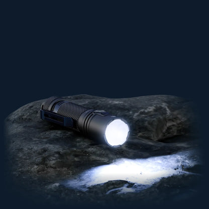 Cree Lighting XP40 Precision Pro flashlight illuminated on rock at night with wide flood beam